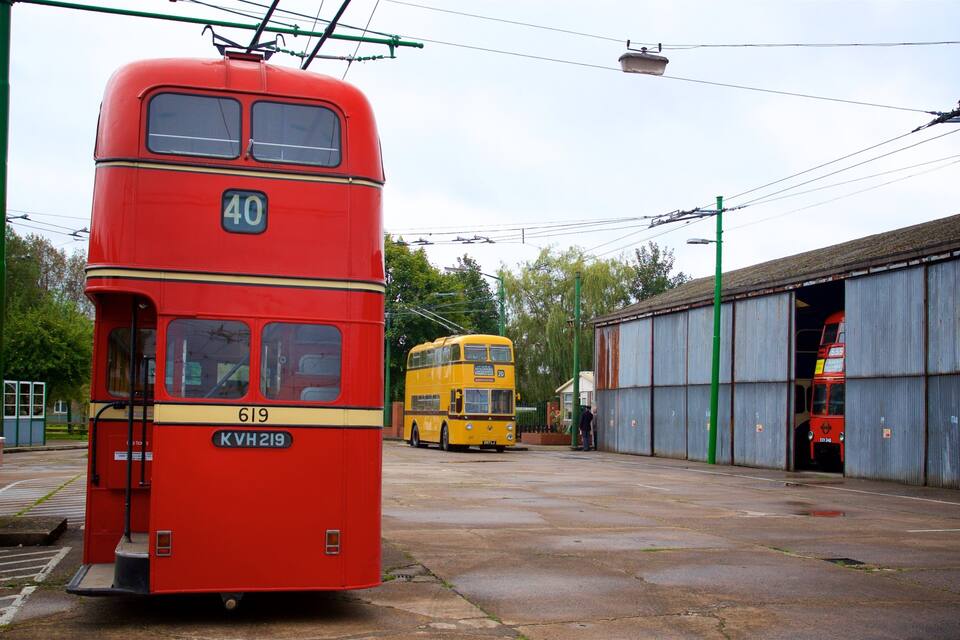 A red double-decker bus with the number 40 parked in a station.