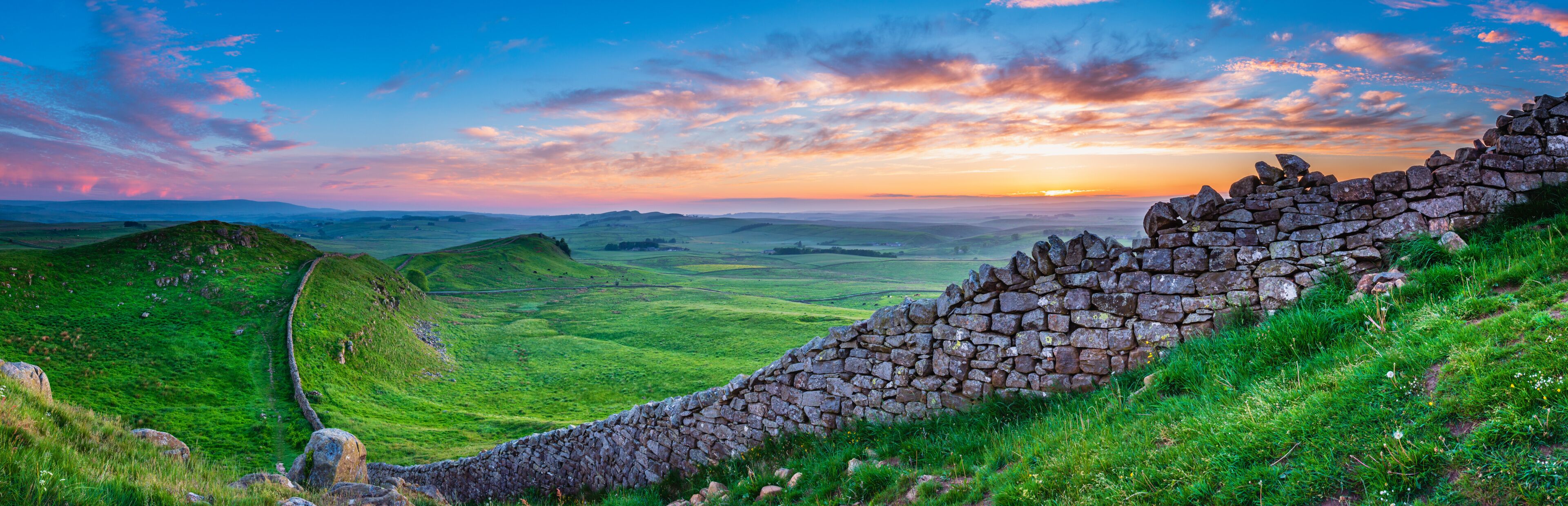 Hadrian's Wall Panorama at Sunset / Hadrian's Wall is a World Heritage Site in the beautiful Northumberland National Park. Popular with walkers along the Hadrian's Wall Path and Pennine Way