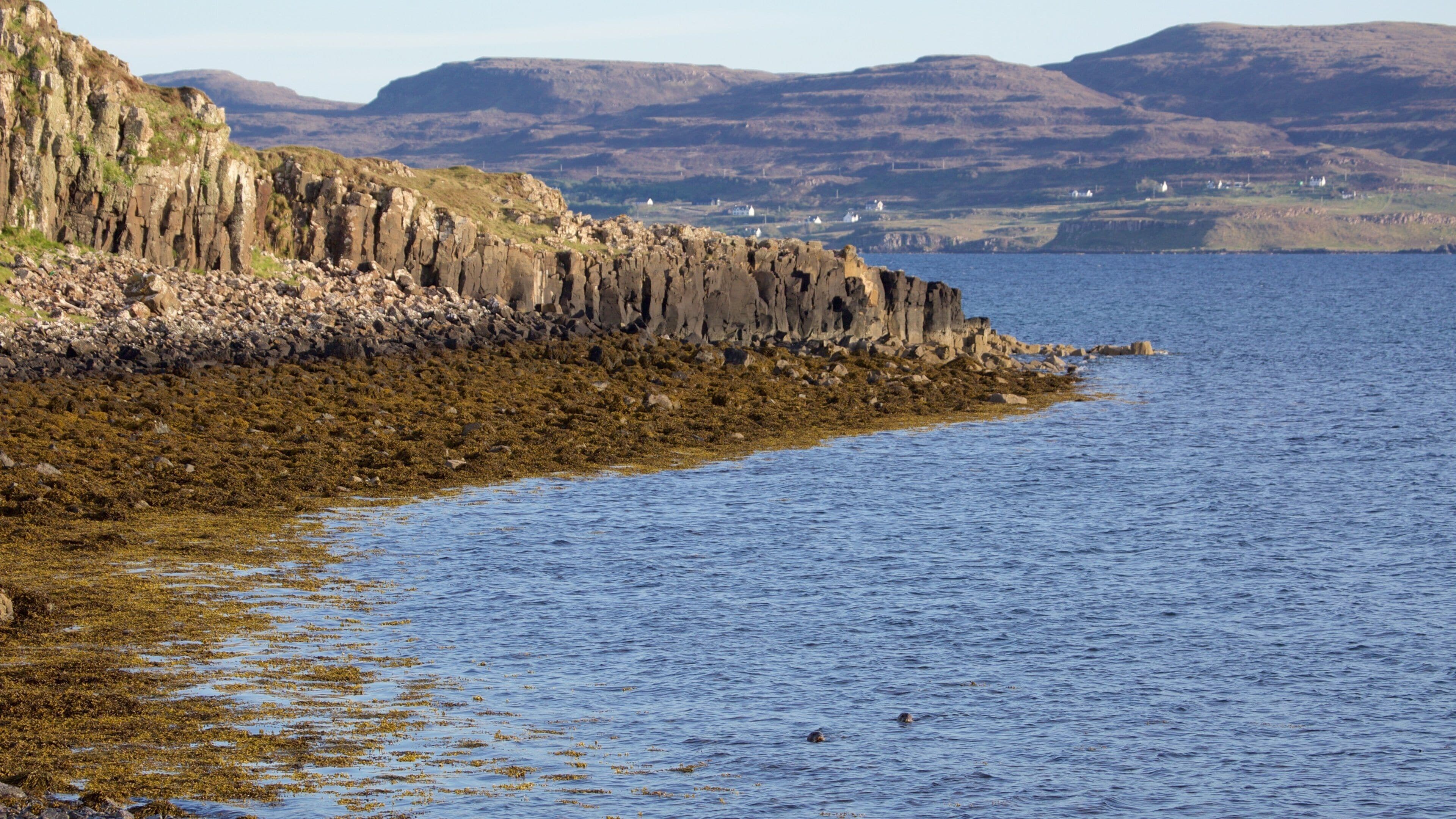 Isle of Skye which includes mountains and rocky coastline