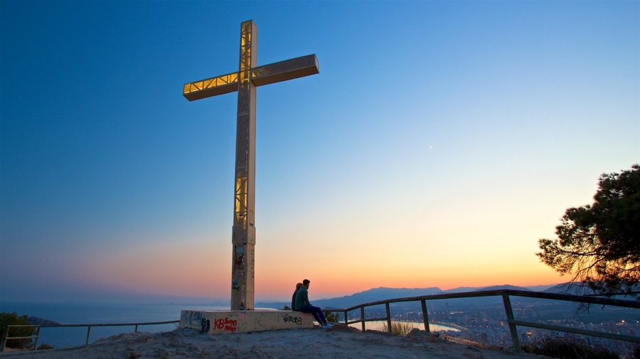 La Cruz Benidorm which includes a sunset, religious elements and landscape views