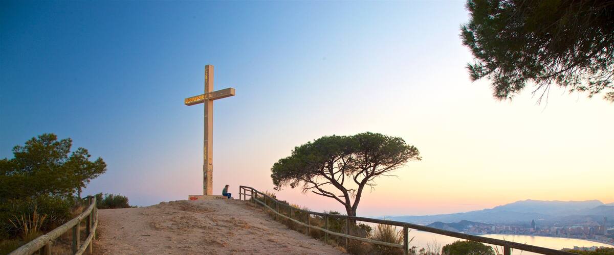 La Cruz Benidorm featuring a monument, a sunset and views