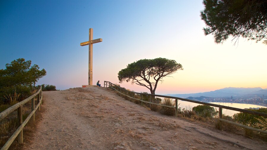 La Cruz Benidorm featuring a monument, a sunset and views