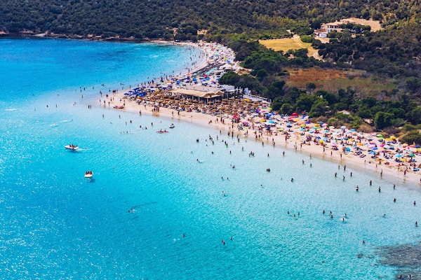 Aerial shot of Tuerredda beach on a beautiful day, Sardinia, Italy. Aerial drone view of Tuerredda in Sardegna. Famous Tuerredda beach on the south of Sardinia near Teulada. Sardinia, Italy.