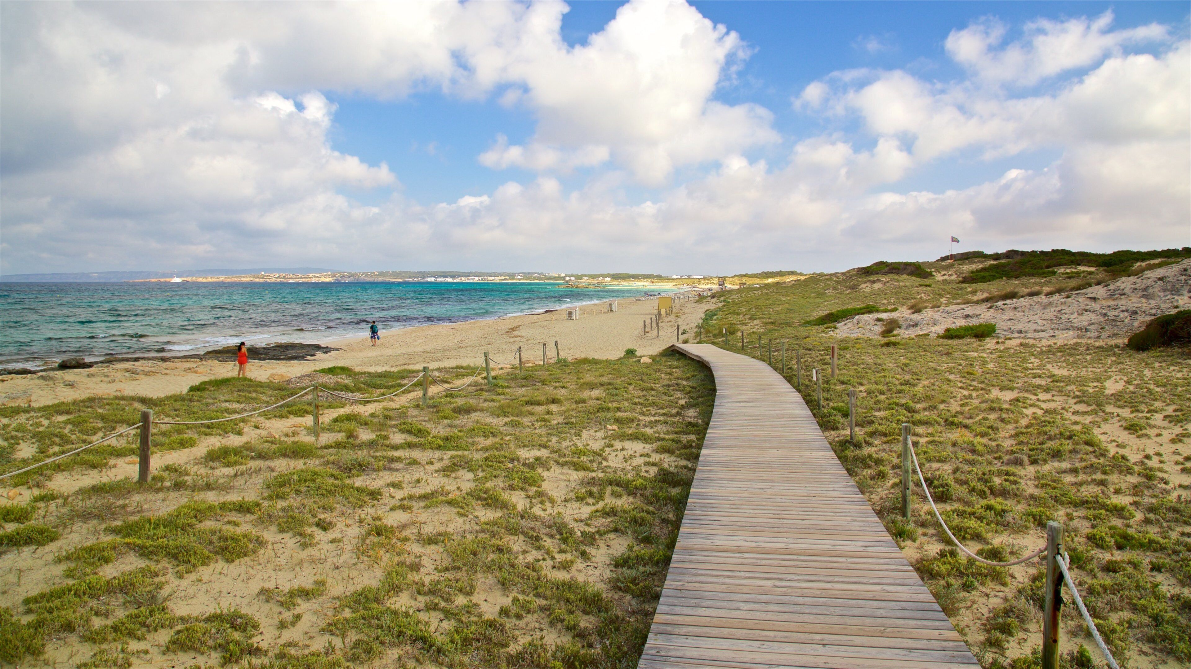 Llevant Beach which includes a sandy beach and general coastal views