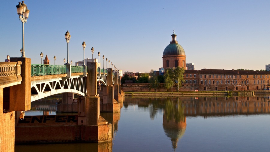 Garonne which includes heritage architecture, a river or creek and a sunset