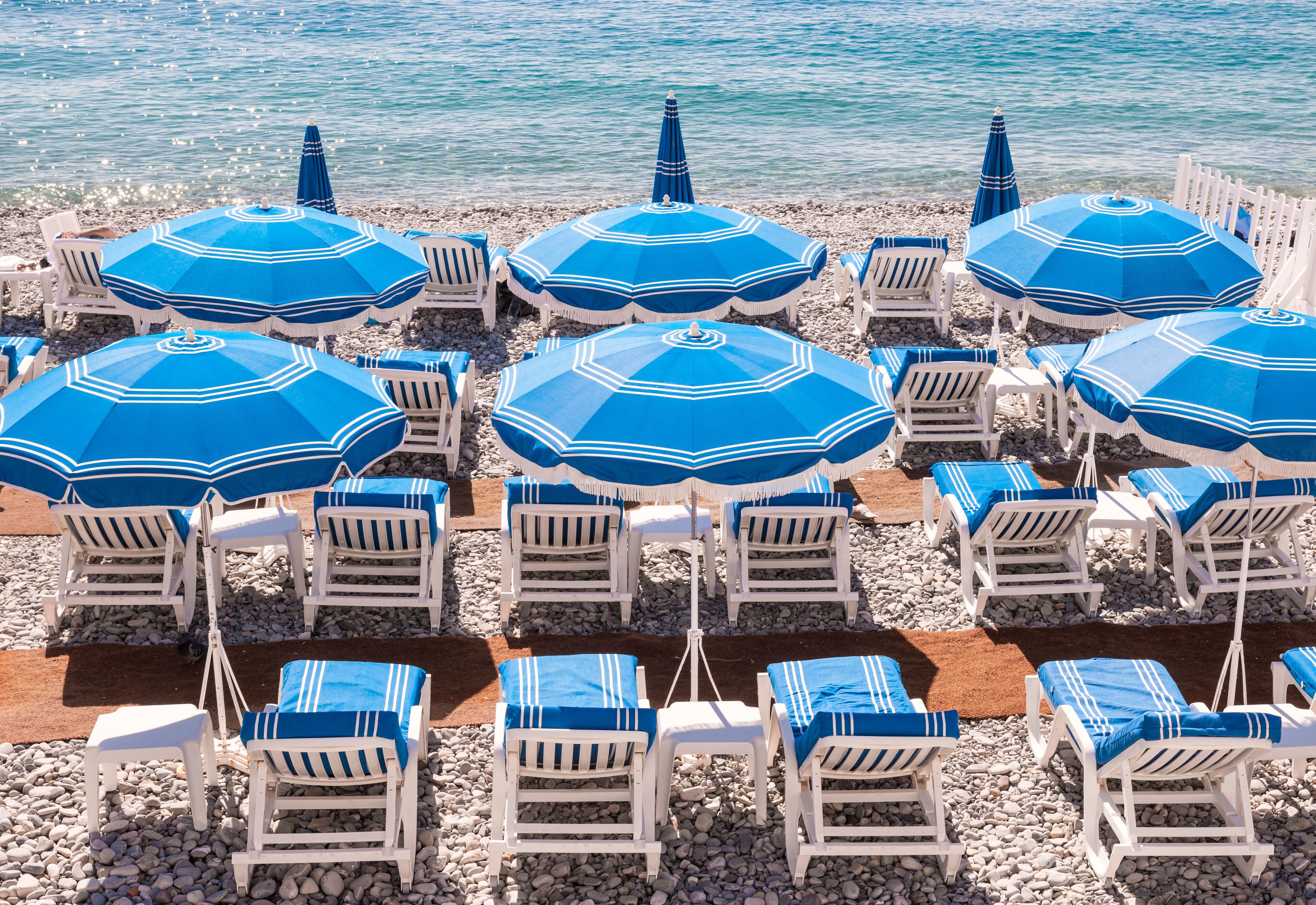 Blue beach umbrellas in Nice