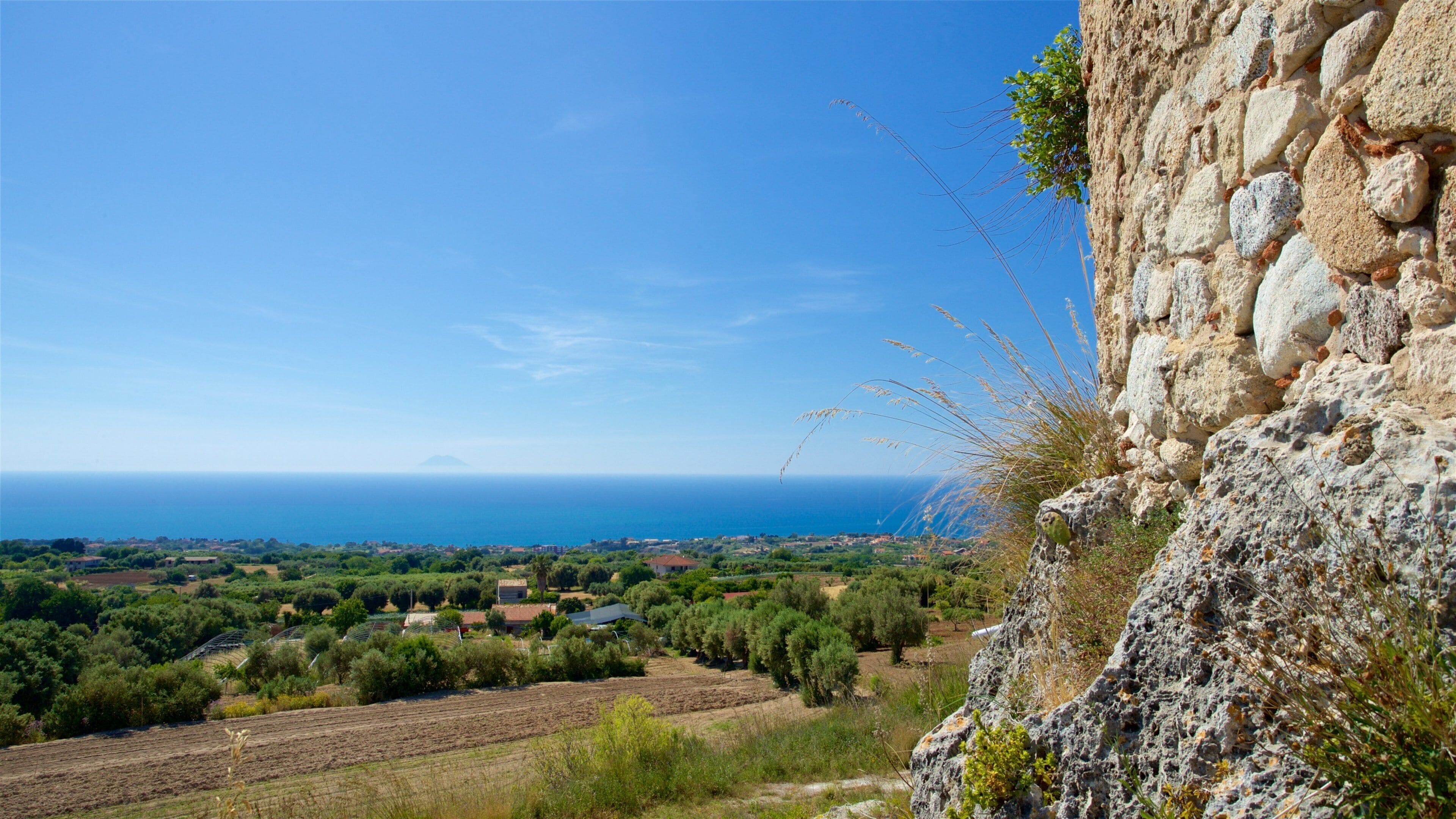 Torre Marrana showing a coastal town and general coastal views