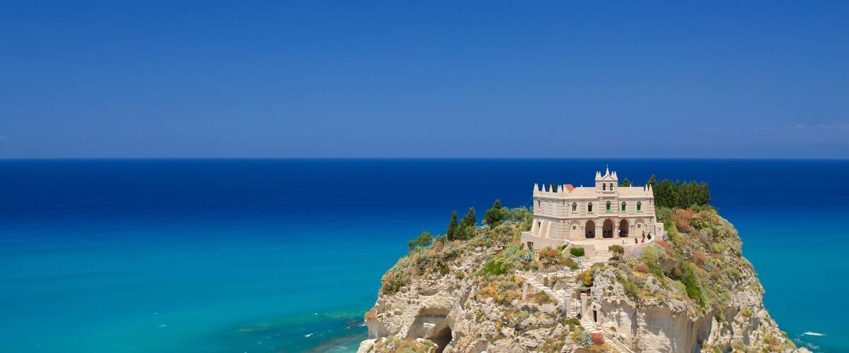 Santa Maria dell\'Isola Monastery which includes landscape views, a castle and general coastal views