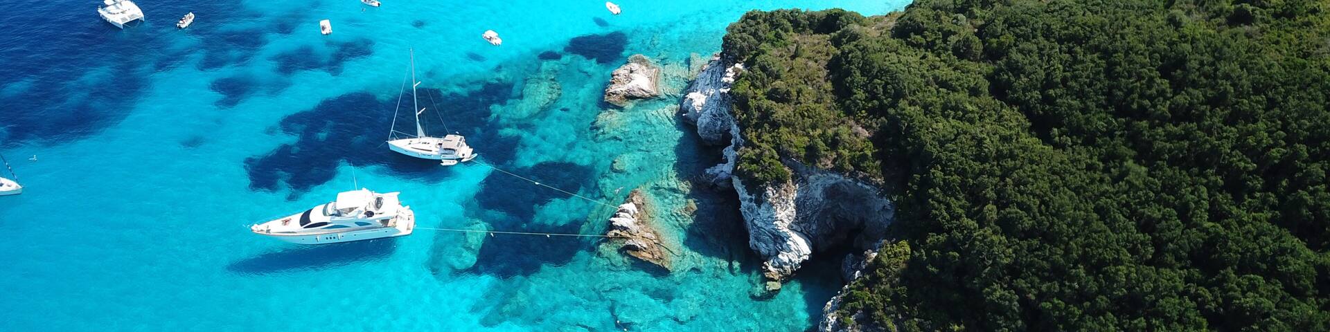 Aerial drone bird's eye view photo of iconic tropical paradise beaches of Voutoumi and Vrika with turquoise clear sea, Antipaxos island, Ionian, Greece