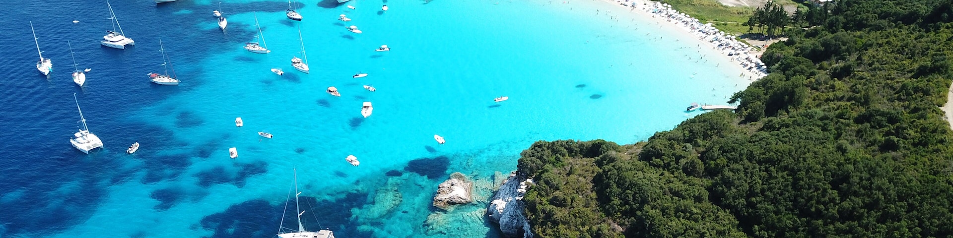 Aerial drone bird's eye view photo of iconic tropical paradise beaches of Voutoumi and Vrika with turquoise clear sea, Antipaxos island, Ionian, Greece