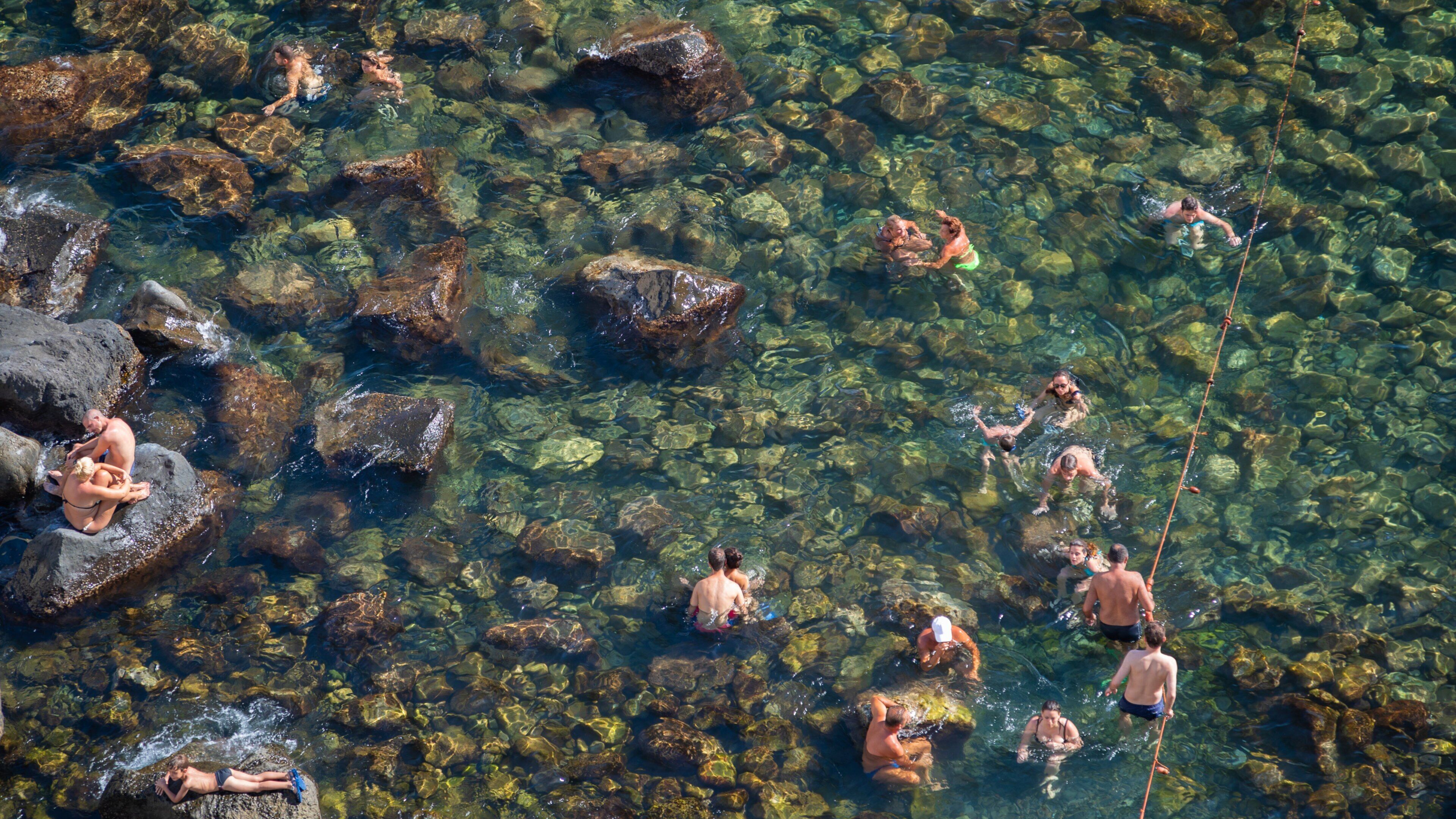 Bay of Sorgeto showing general coastal views, rugged coastline and swimming