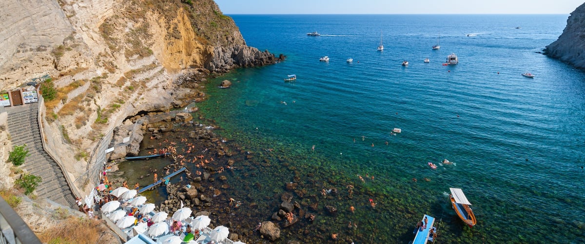 Bay of Sorgeto which includes general coastal views, rugged coastline and landscape views