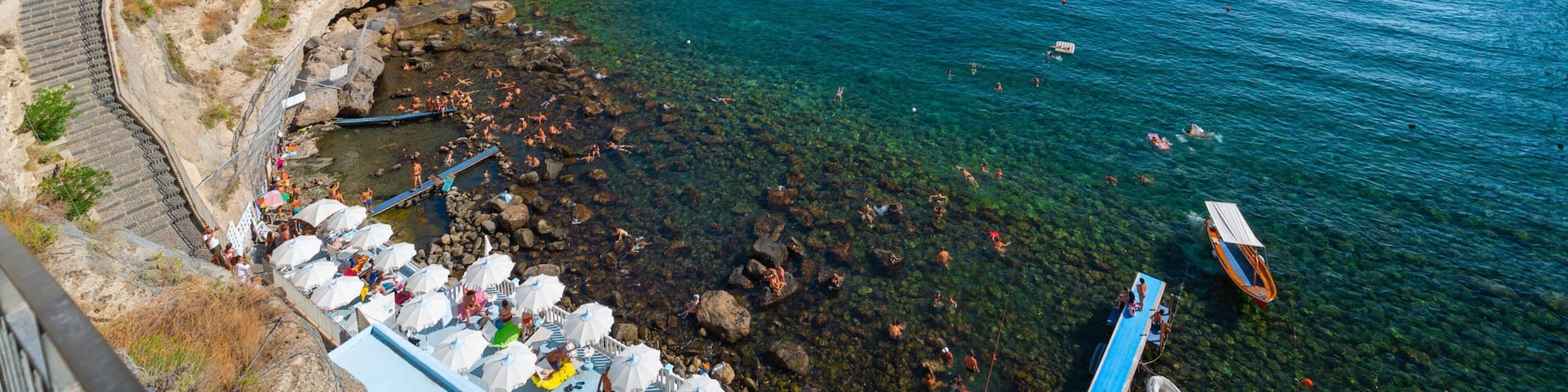 Bay of Sorgeto which includes general coastal views, rugged coastline and landscape views