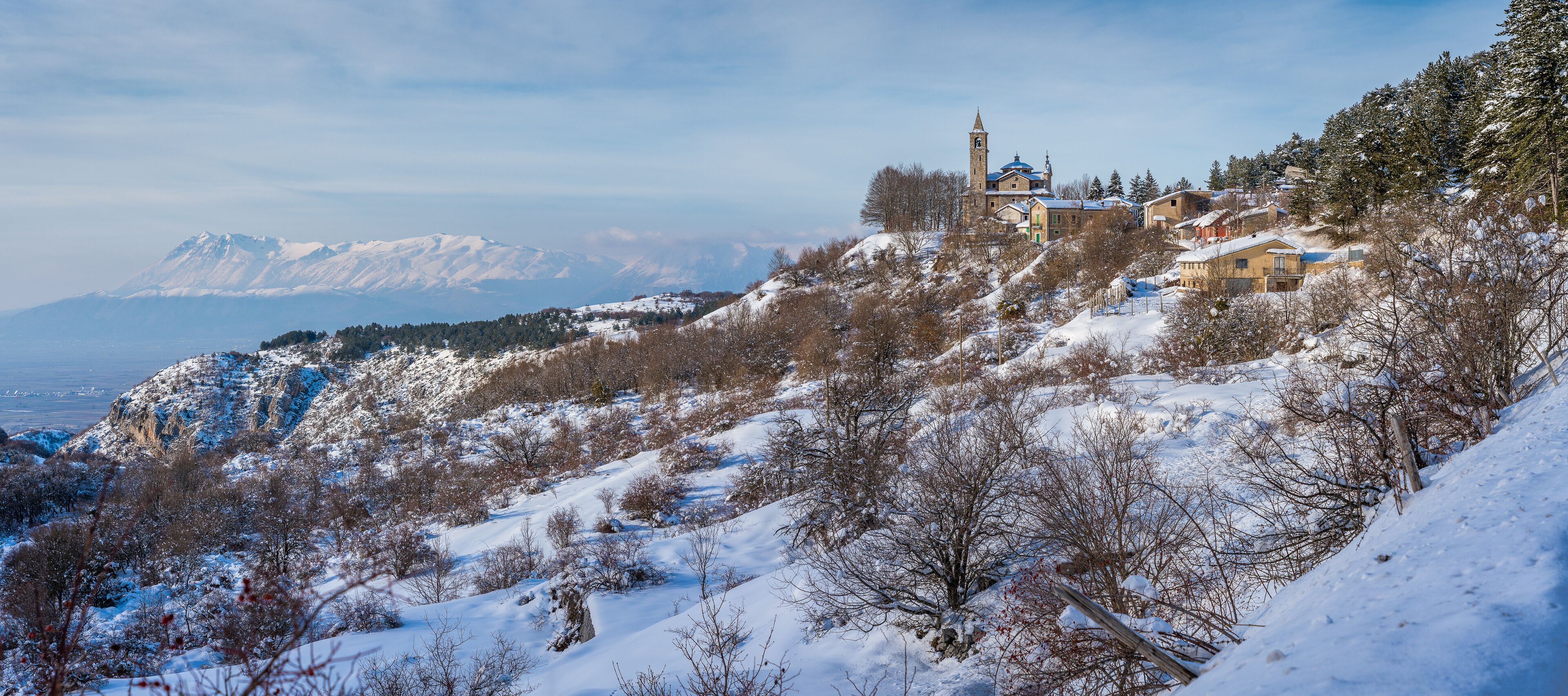 Panoramic sight of the small village of Gioia Vecchio during winter, near Pescasseroli, in Abruzzo National Park. Italy.