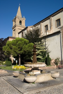ADCGNG View of the fountain and of the Santa Maria Assunta Cathedral from Garibaldi square in Cervia, Ravenna, Emilia Romagna, Italy.