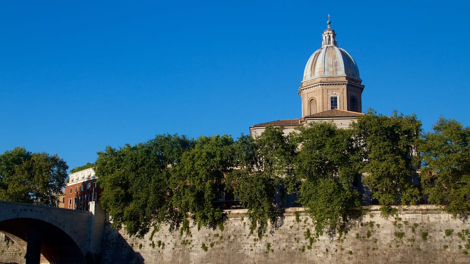 A historic building with a dome and a bridge in the foreground.