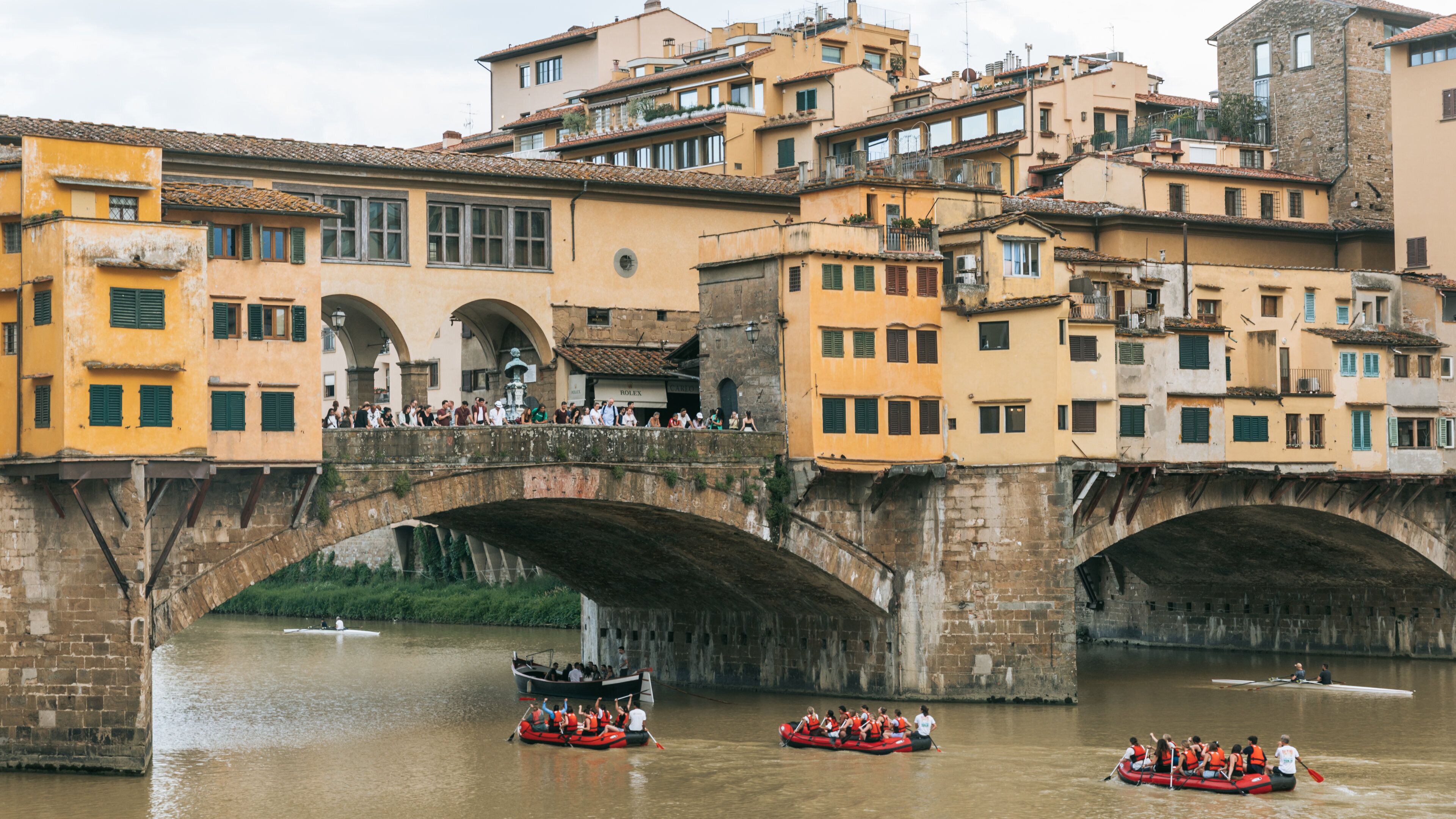 Arno River featuring a river or creek, a bridge and kayaking or canoeing