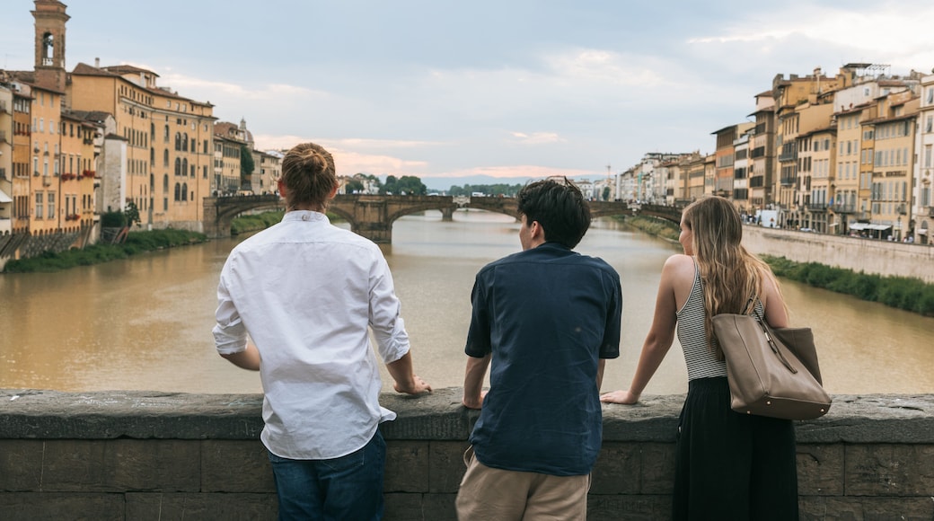 Arno River featuring a river or creek and views as well as a small group of people