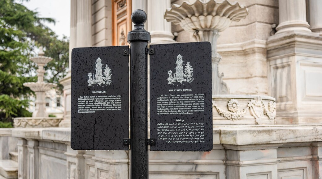 Dolmabahce Clock Tower which includes signage and heritage elements