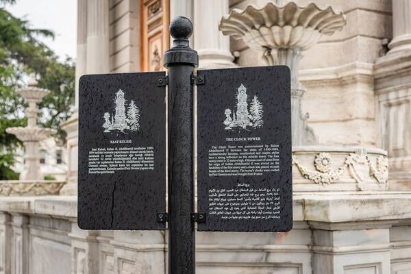 Dolmabahce Clock Tower which includes signage and heritage elements