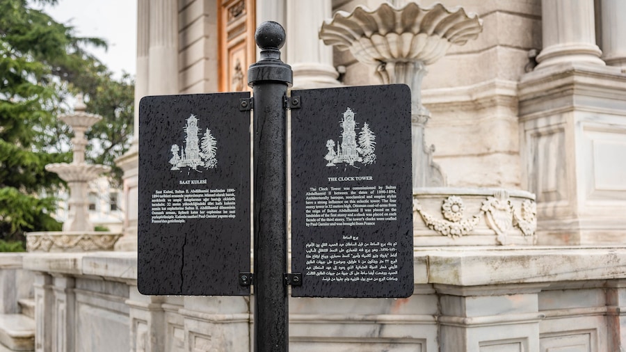 Dolmabahce Clock Tower which includes signage and heritage elements