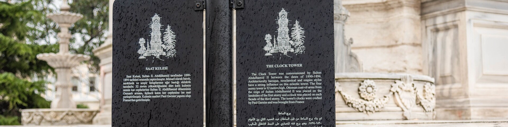 Dolmabahce Clock Tower which includes signage and heritage elements