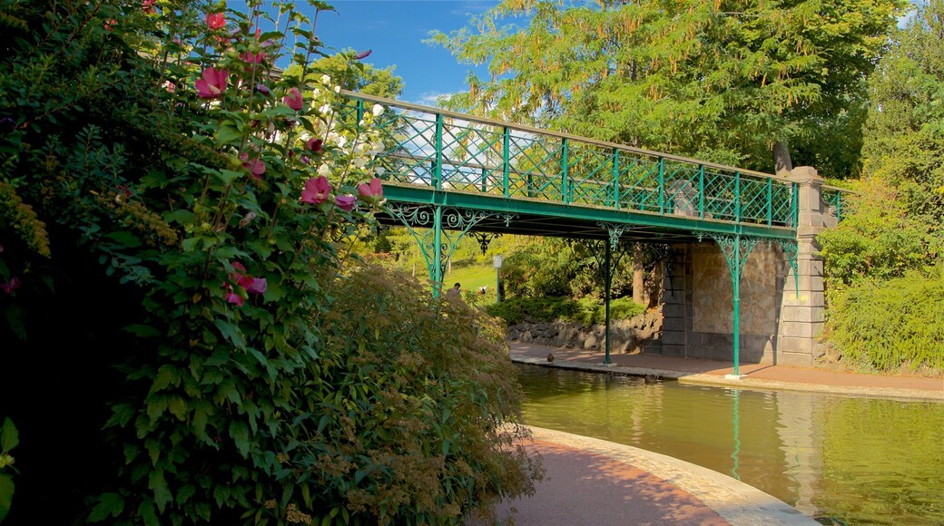 Jardin Lecoq featuring a river or creek and a bridge