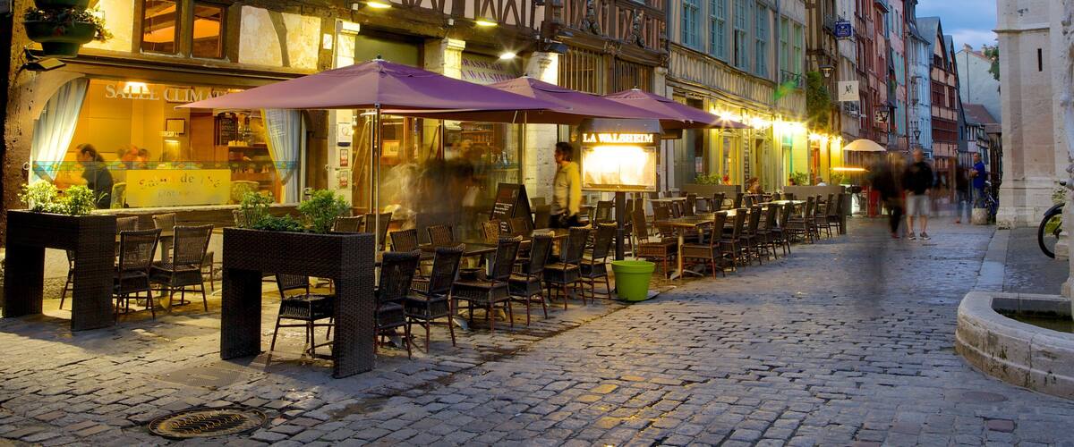 A cobblestone street with outdoor seating at a restaurant named "La Walheim."