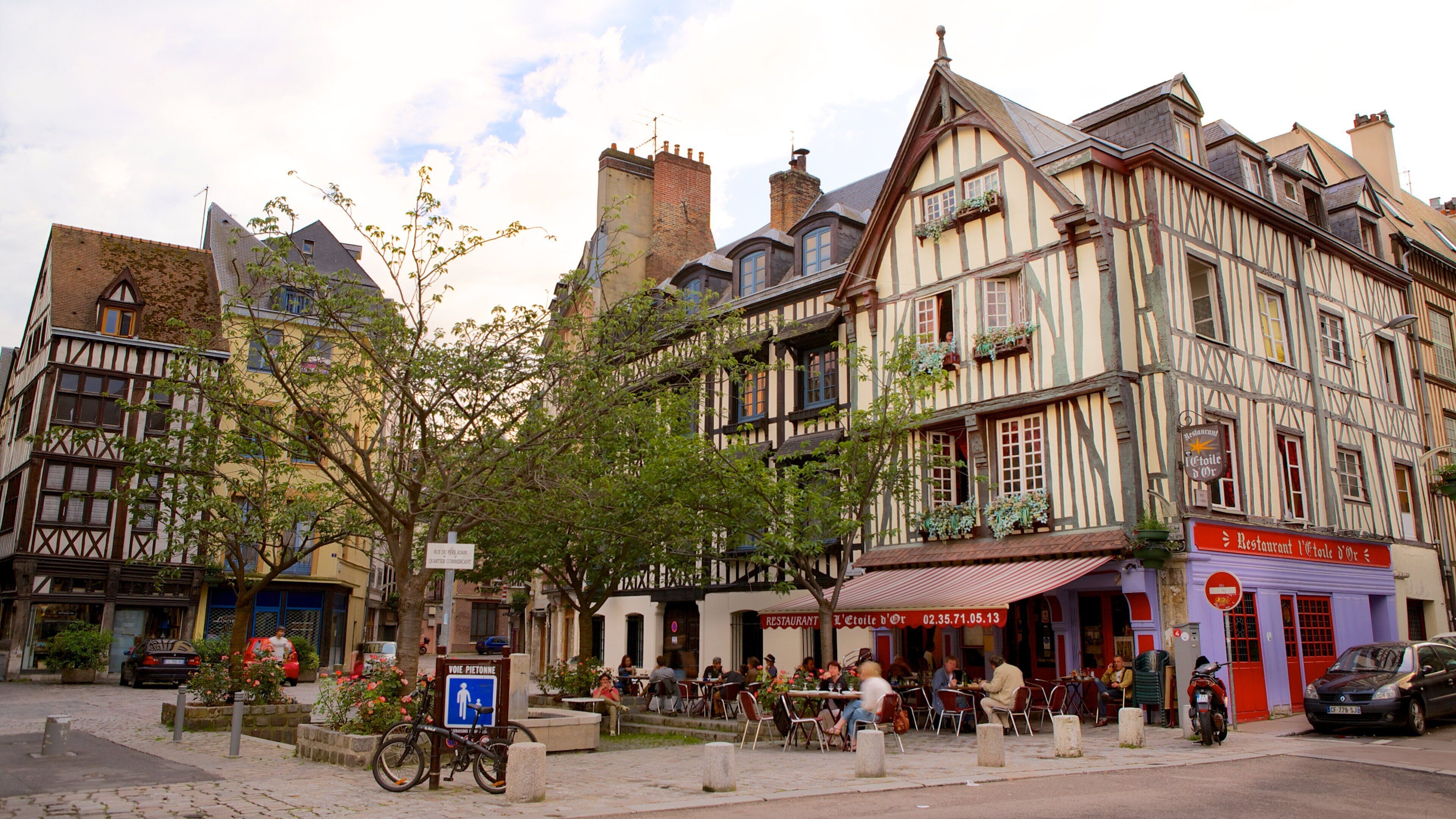 Rouen which includes outdoor eating and a city