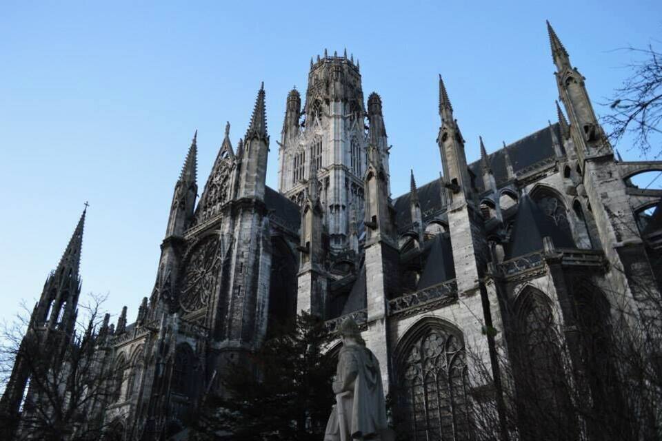 A Gothic cathedral with tall spires and intricate stonework.