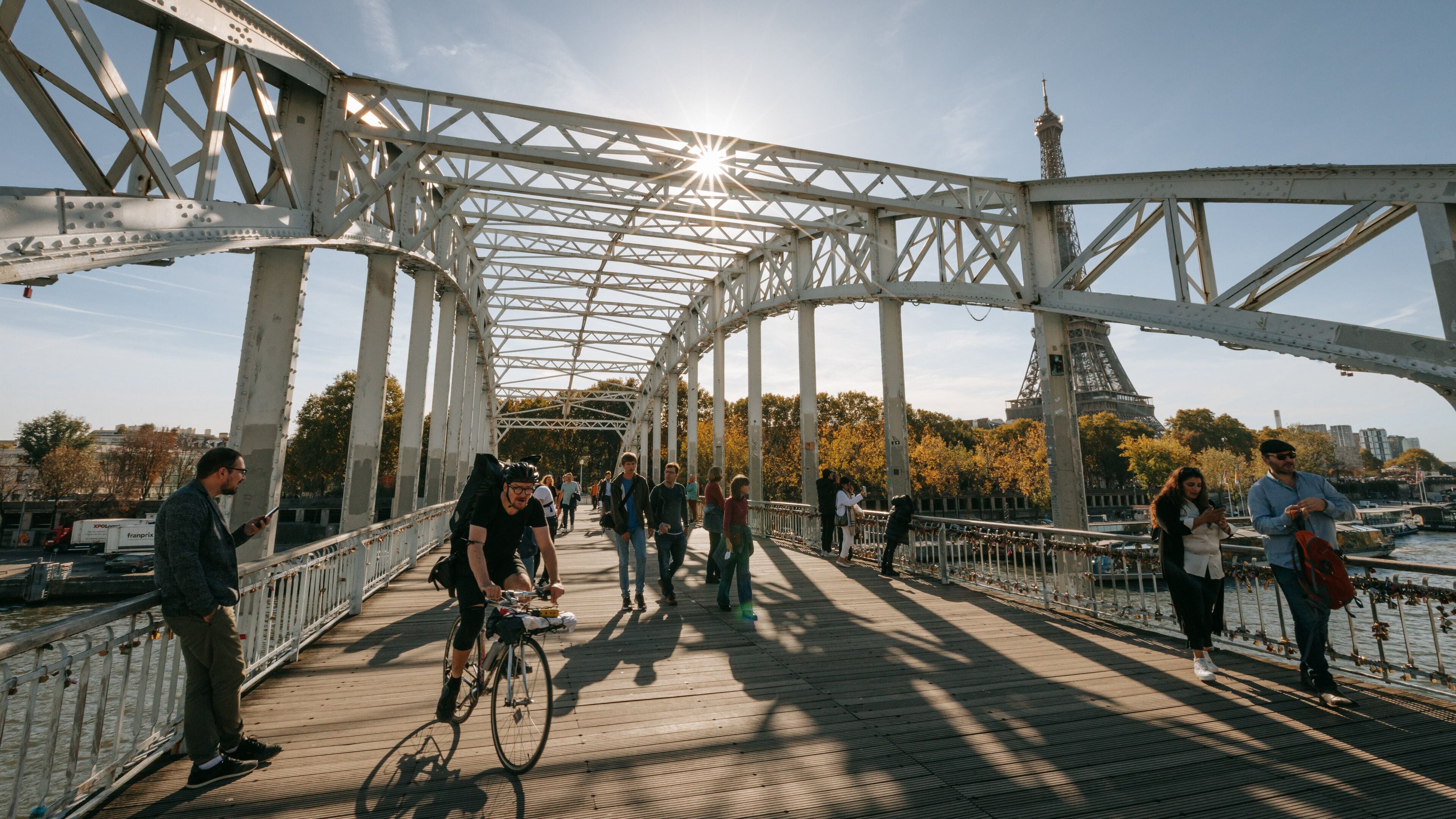 Passerelle Debilly featuring street scenes, a sunset and a bridge