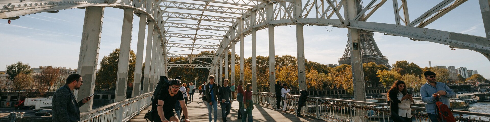 Passerelle Debilly featuring street scenes, a sunset and a bridge