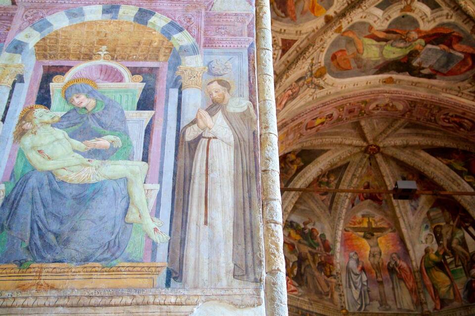 A detailed fresco with religious figures and architectural elements.