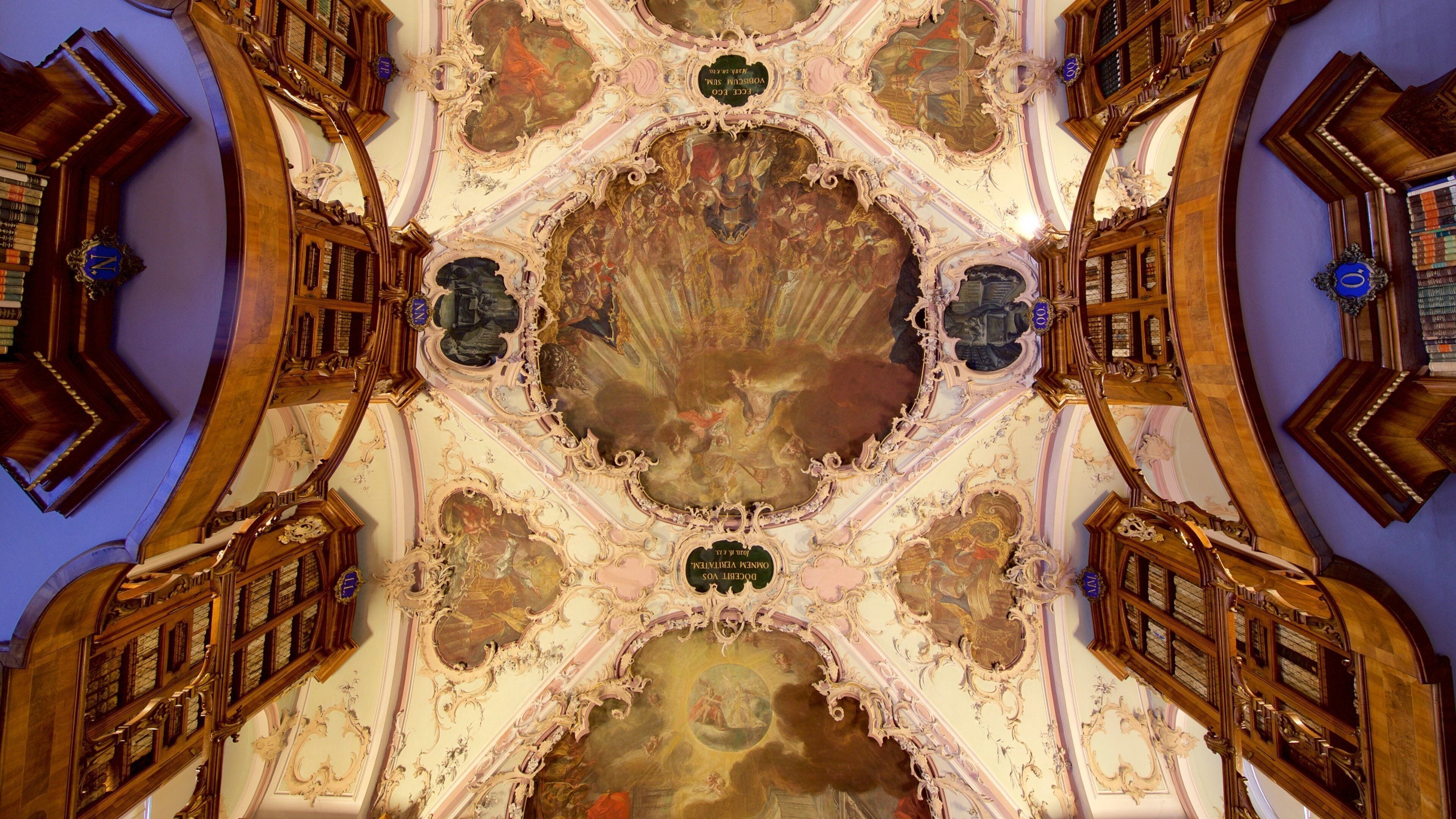 An ornate ceiling with intricate frescoes and a central circular design.