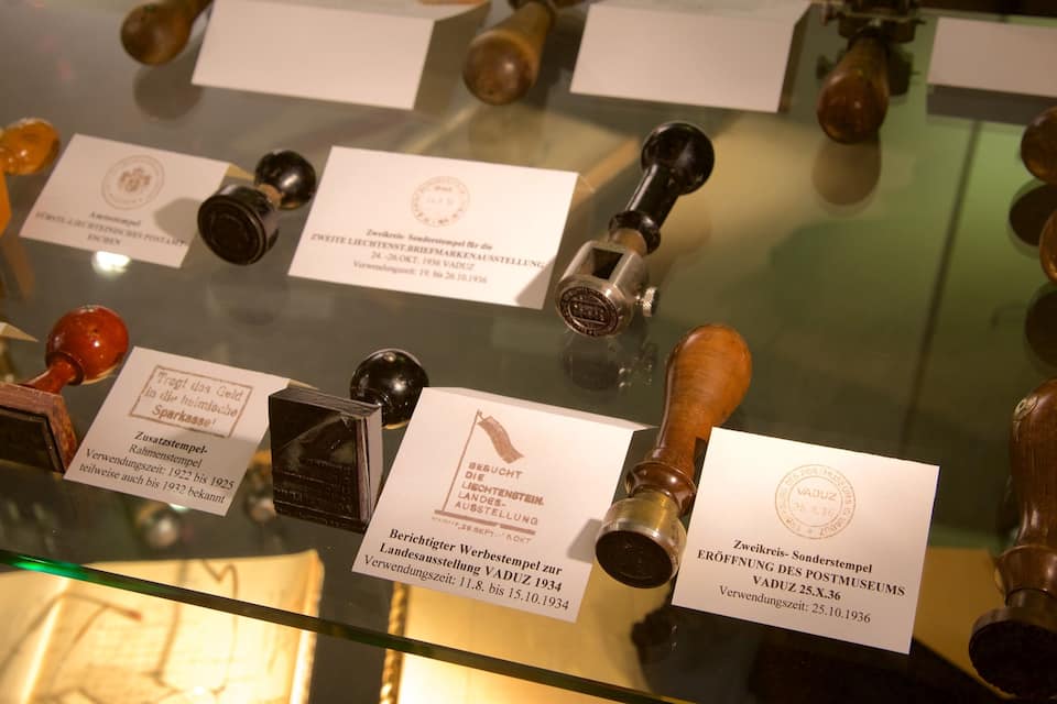 A display of vintage stamps with their labels.