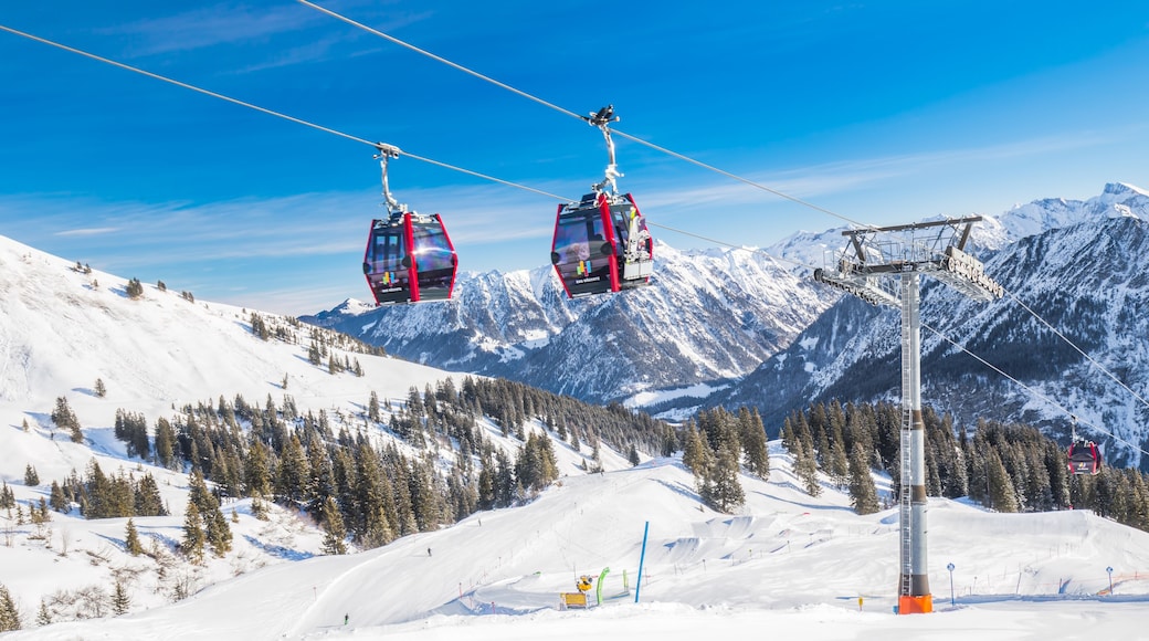 Skiers in cable car enjoying stunning view to Bavarian Alps, Fellhorn, Oberstdorf, Germany