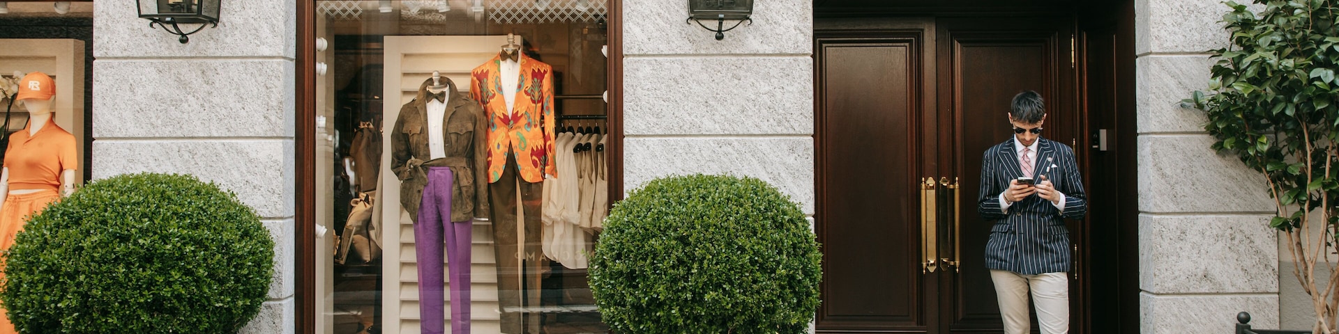 Milan Fashion District which includes shopping and street scenes as well as an individual male