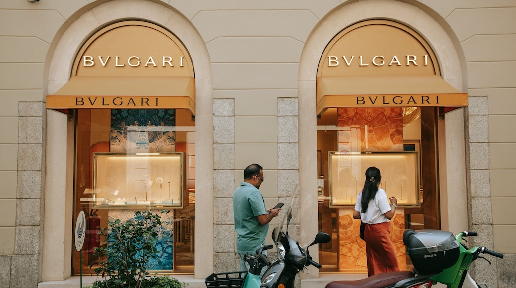 Milan Fashion District which includes signage, shopping and street scenes