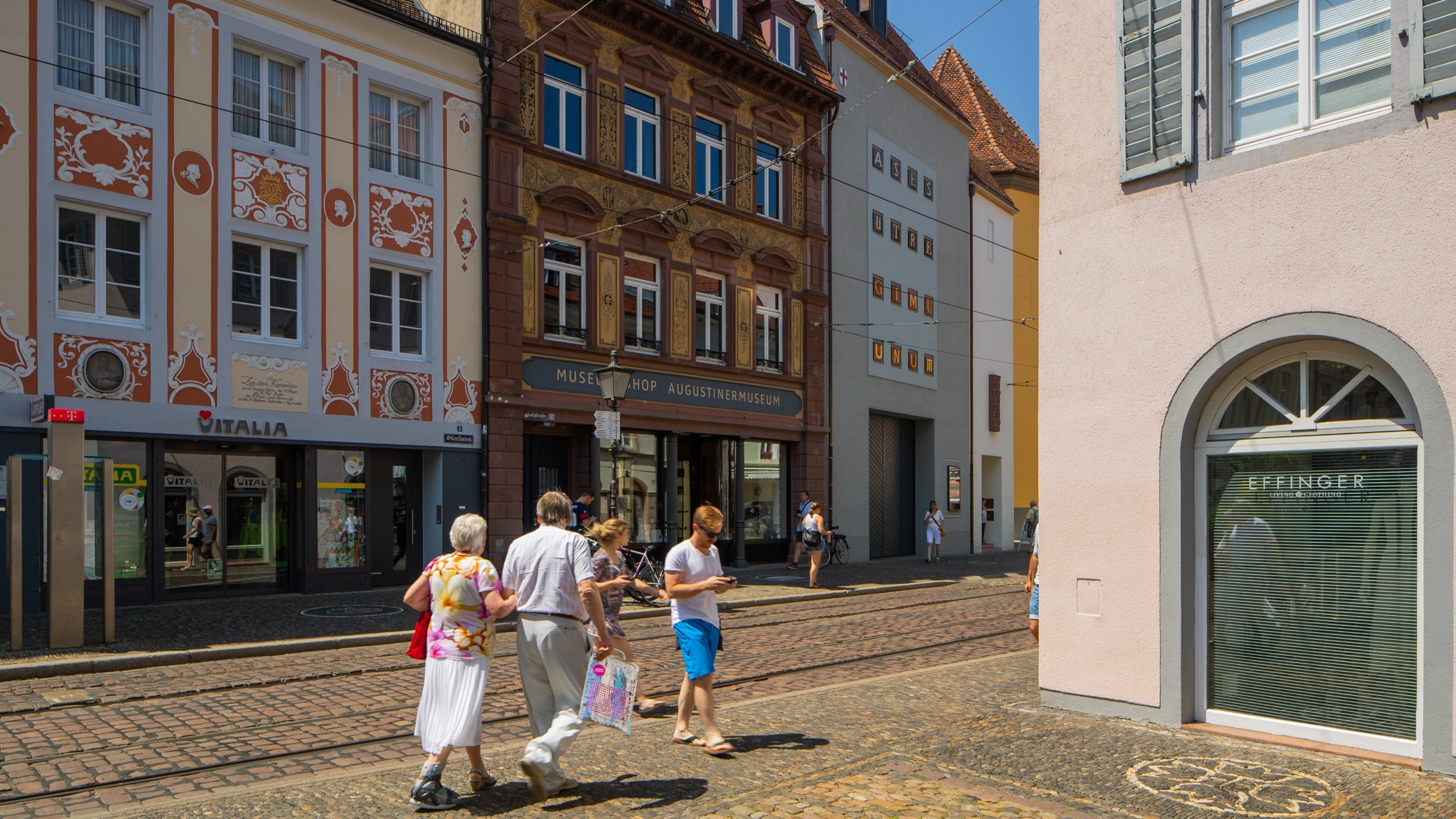 Augustinermuseum featuring street scenes and a city as well as a couple