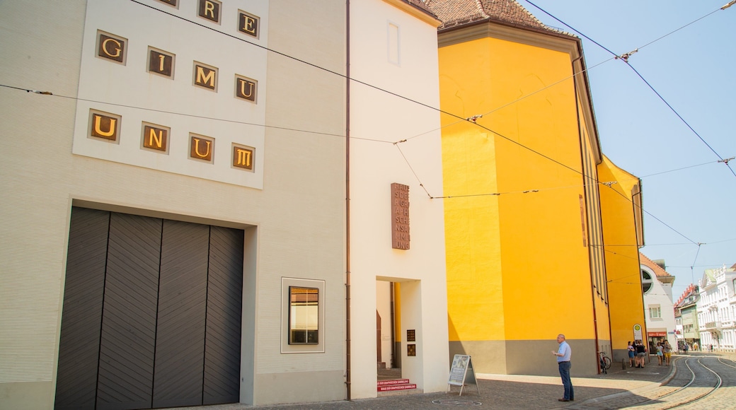 Augustinermuseum featuring a city, signage and street scenes