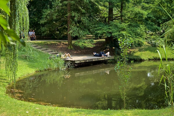 Botanical Gardens featuring a lake or waterhole and a garden