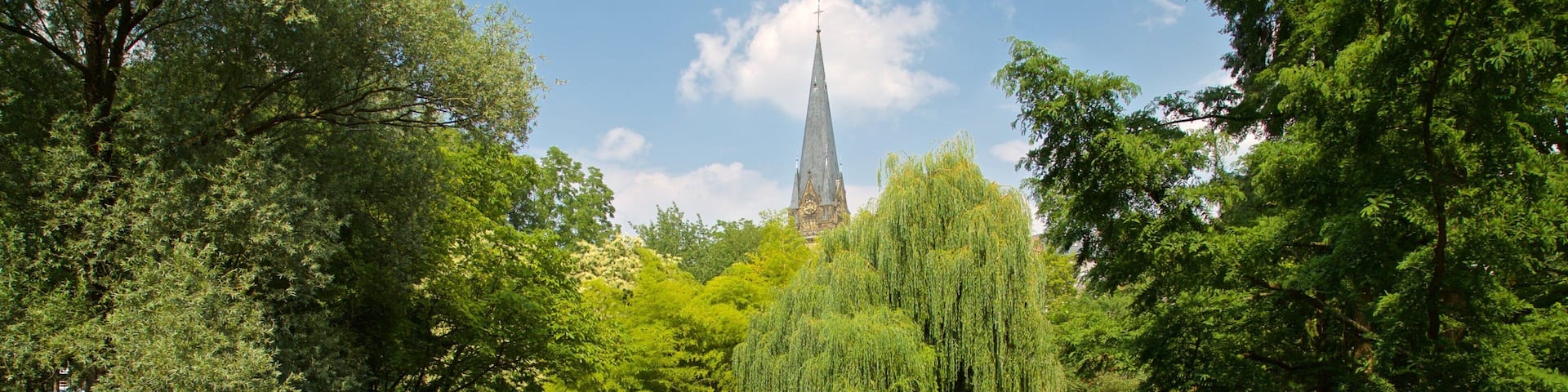 Botanical Gardens featuring a park and a lake or waterhole as well as a small group of people