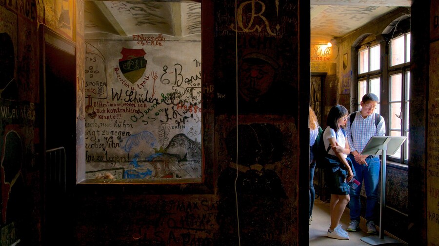 Heidelberg showing interior views and outdoor art as well as a small group of people