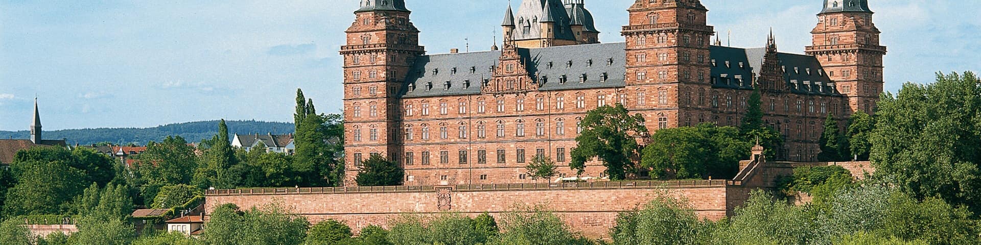 Schloss Johannisburg and Grounds showing heritage architecture, landscape views and a lake or waterhole
