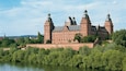 Schloss Johannisburg and Grounds showing heritage architecture, landscape views and a lake or waterhole