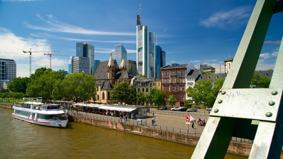 Frankfurt which includes a high-rise building, a lake or waterhole and a city