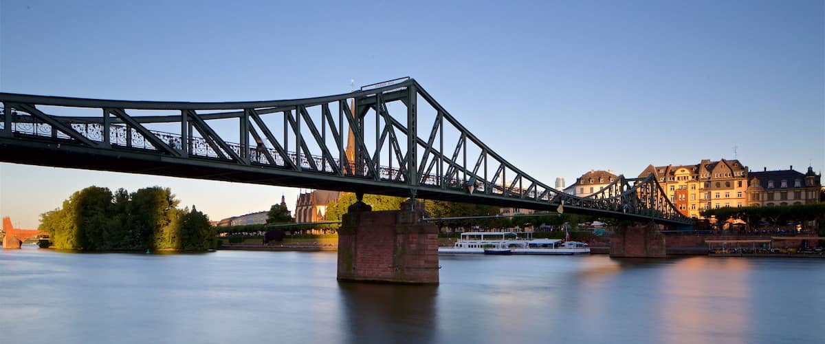 Eiserner Steg featuring a river or creek, a sunset and a bridge