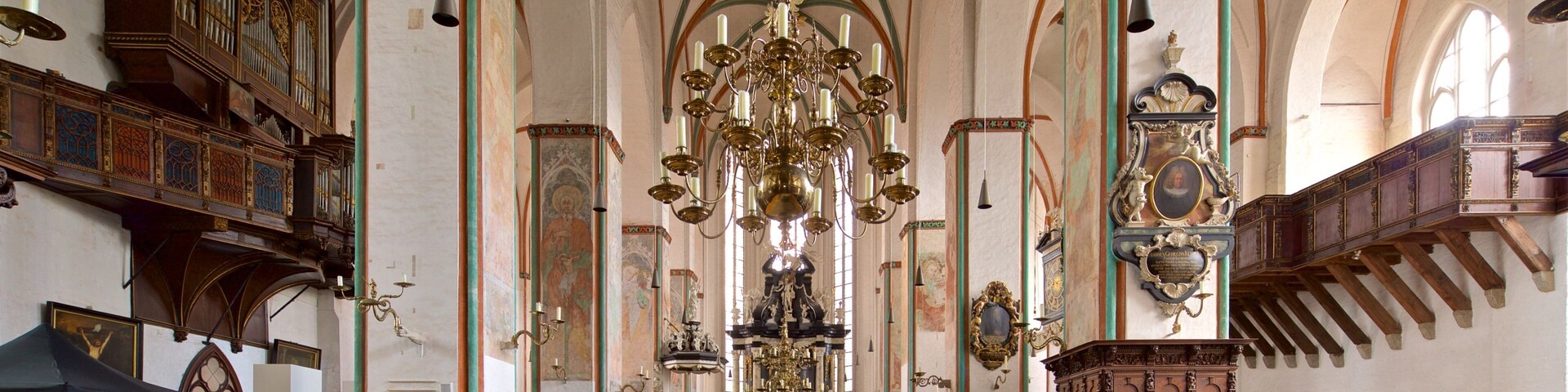 St. Jakobi Church featuring a church or cathedral, heritage elements and interior views