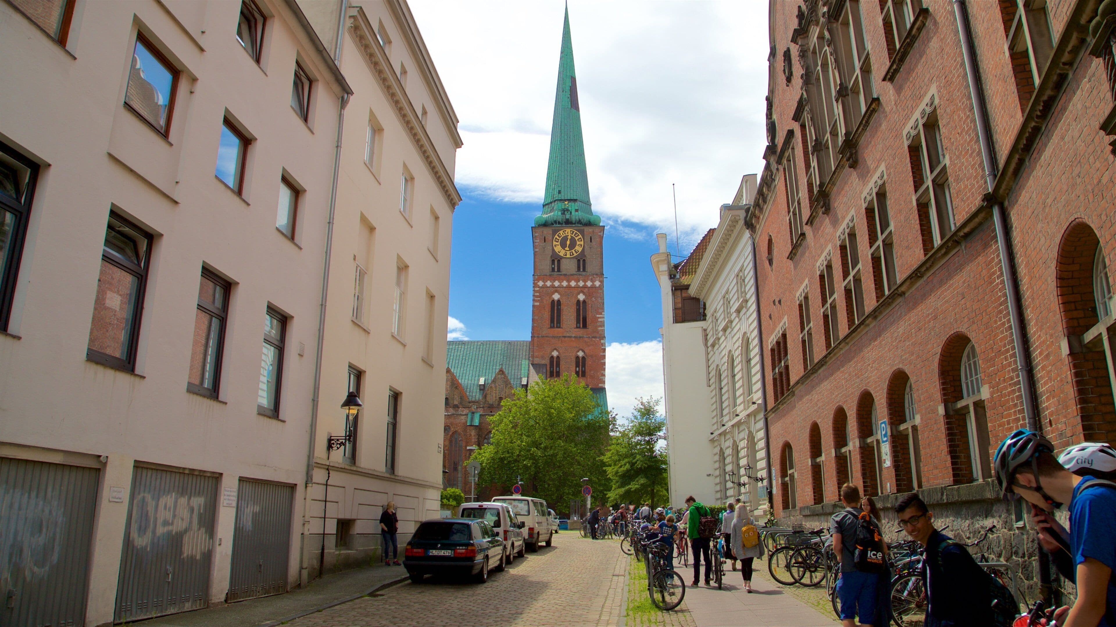 St. Jakobi Church featuring heritage architecture and street scenes as well as a small group of people