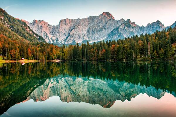 View over Mangart mountain at Laghi di Fusine lake, Friuli-Venezia Giulia, Italy